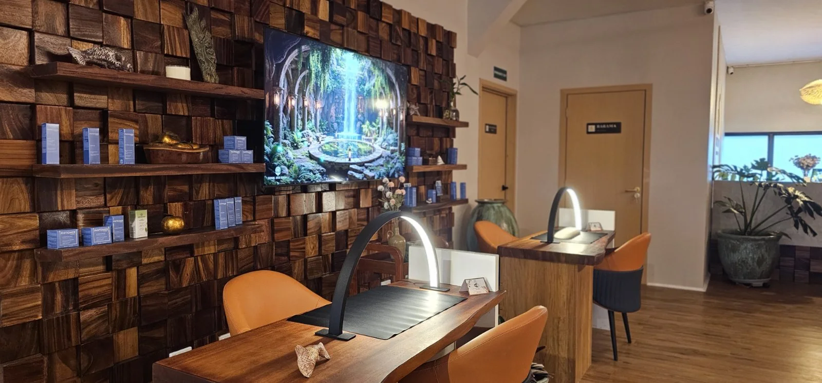 Beauty treatment stations against a sculptural timber wall